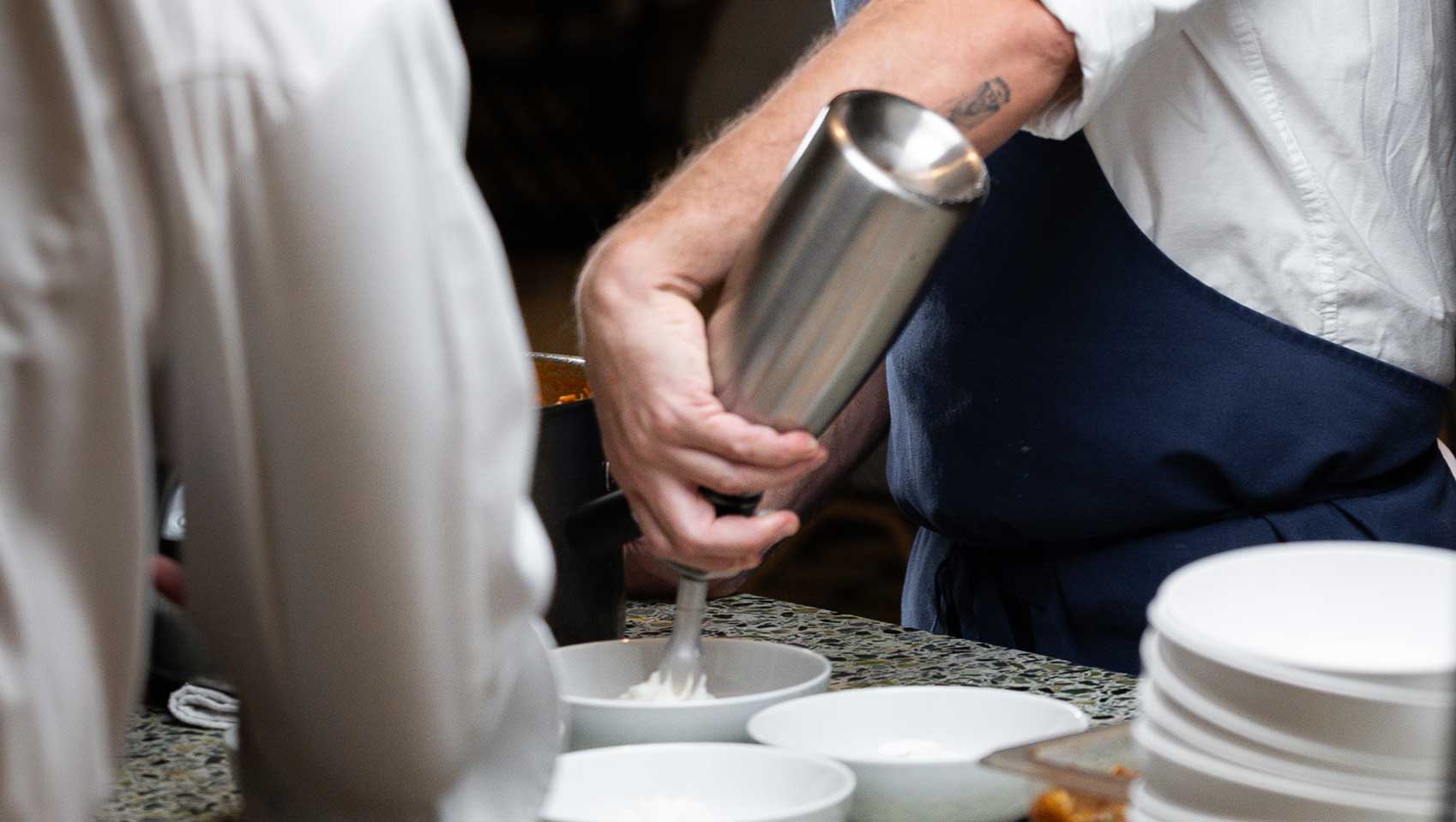 Chef adds foam to dish at Kimpton Grand Roatan