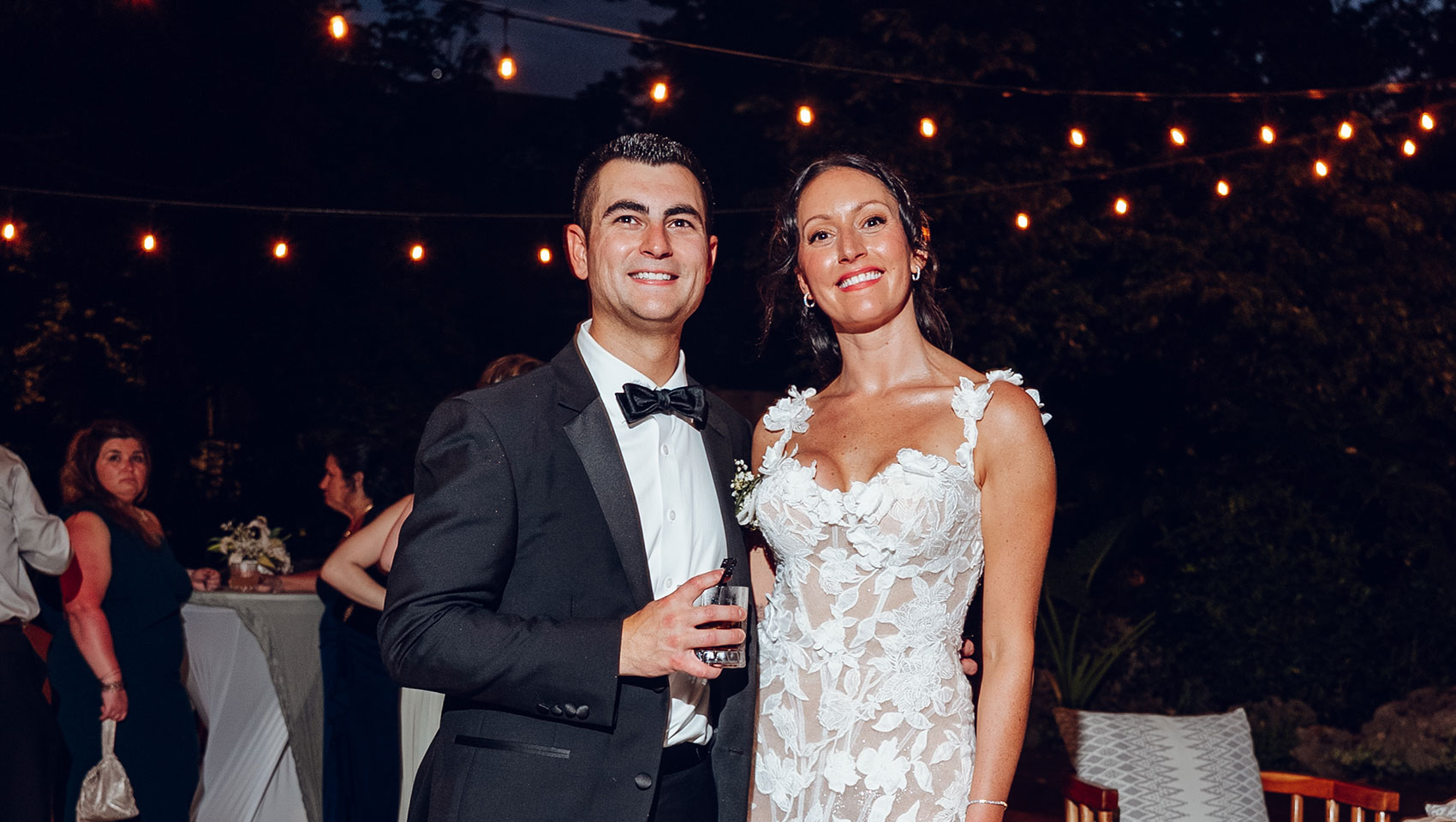 Newlyweds at outdoor evening reception at Kimpton Grand Roatan