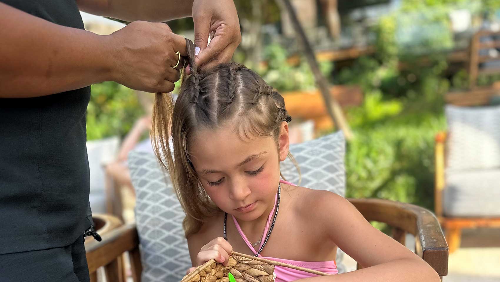 girl getting her hair braided