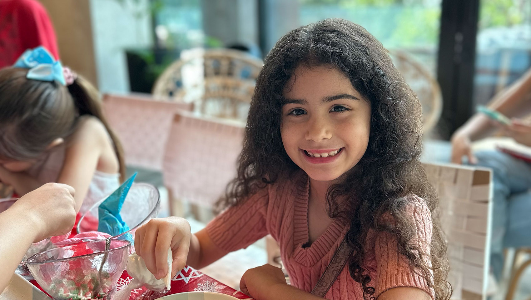 child guest at Kimpton Grand Roatan decorating holiday cookies