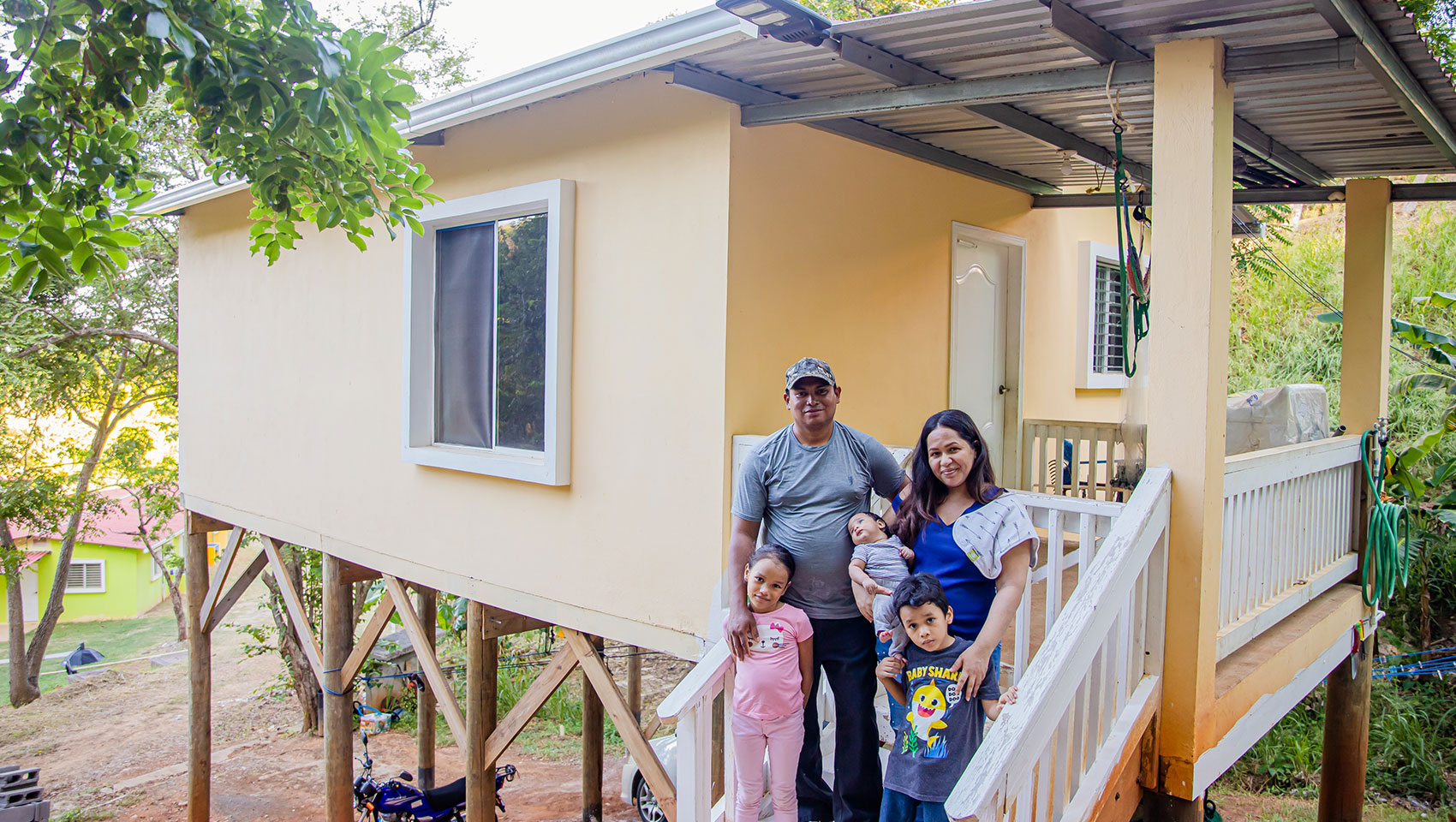 Family in front of house