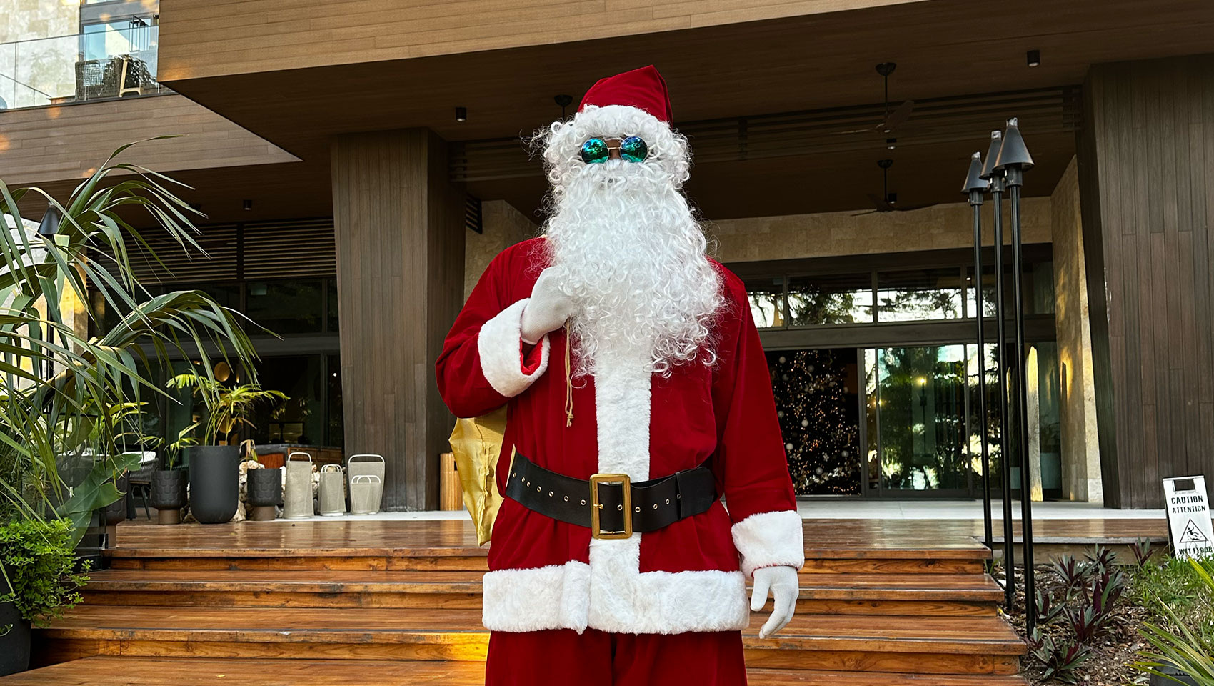 Santa stands in front of Kimpton Grand Roatan