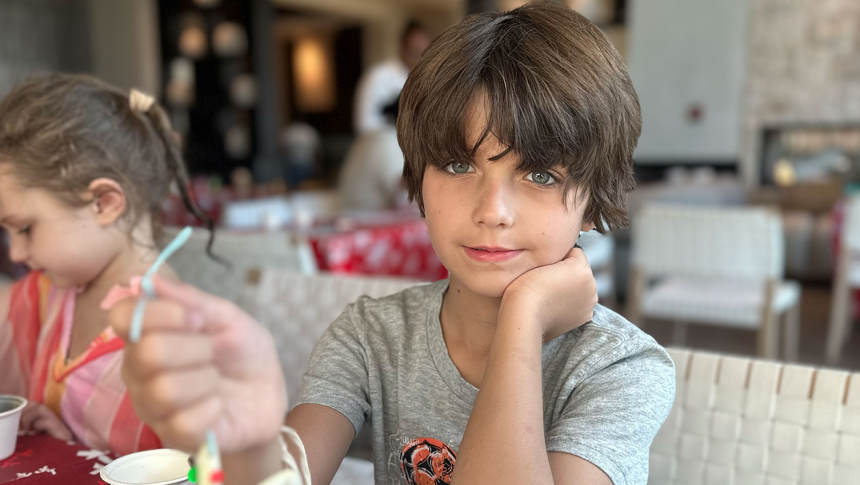 child guest at Kimpton Grand Roatan showing off homemade ornament