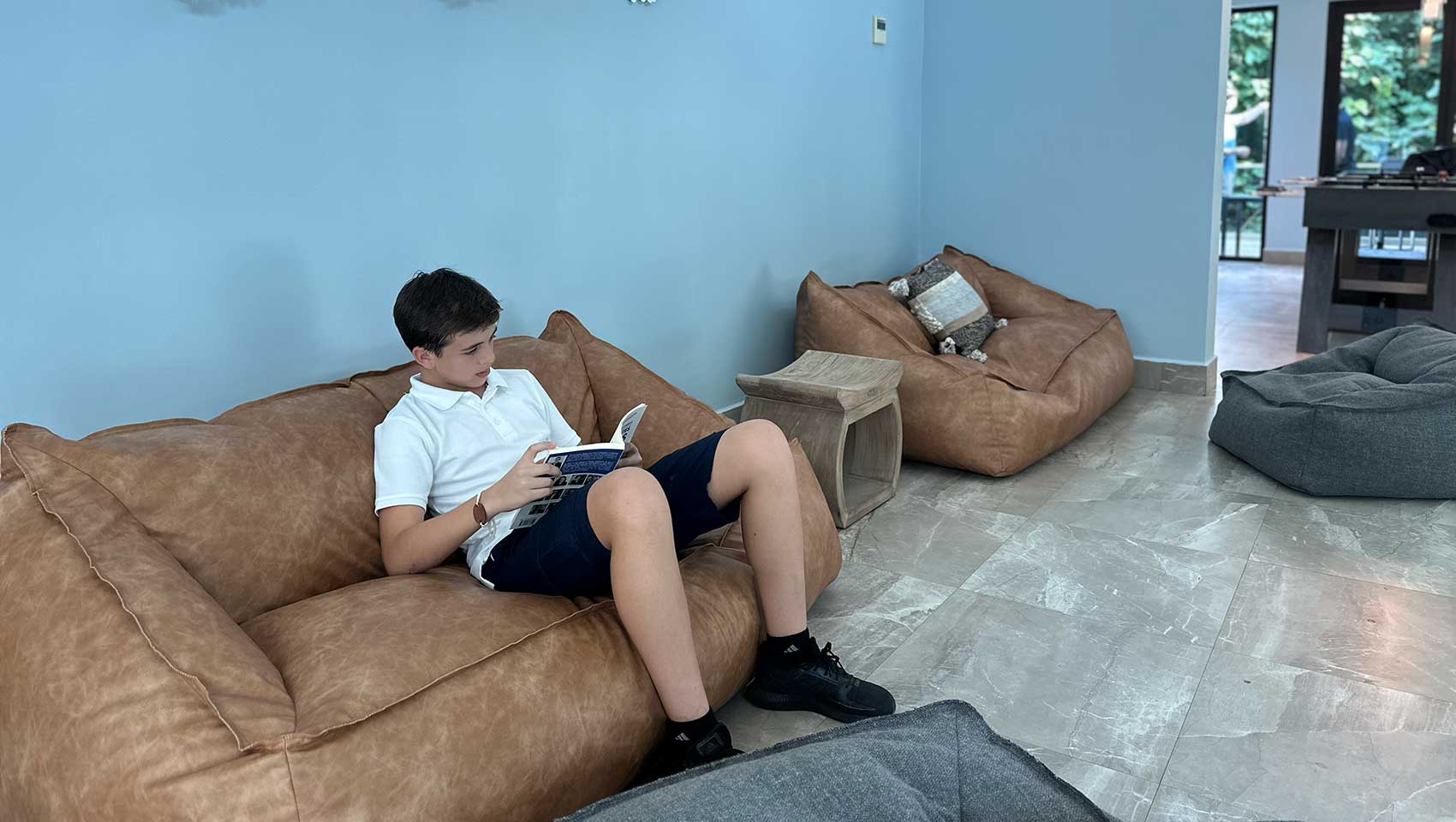 boy reading on couch