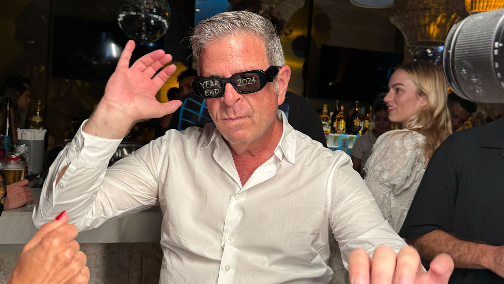 man in sunglasses dancing at Kimpton Grand Roatan