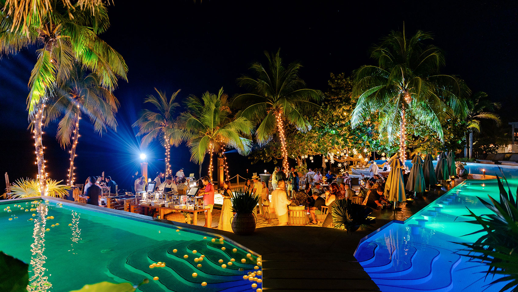 wedding reception at night by the pool