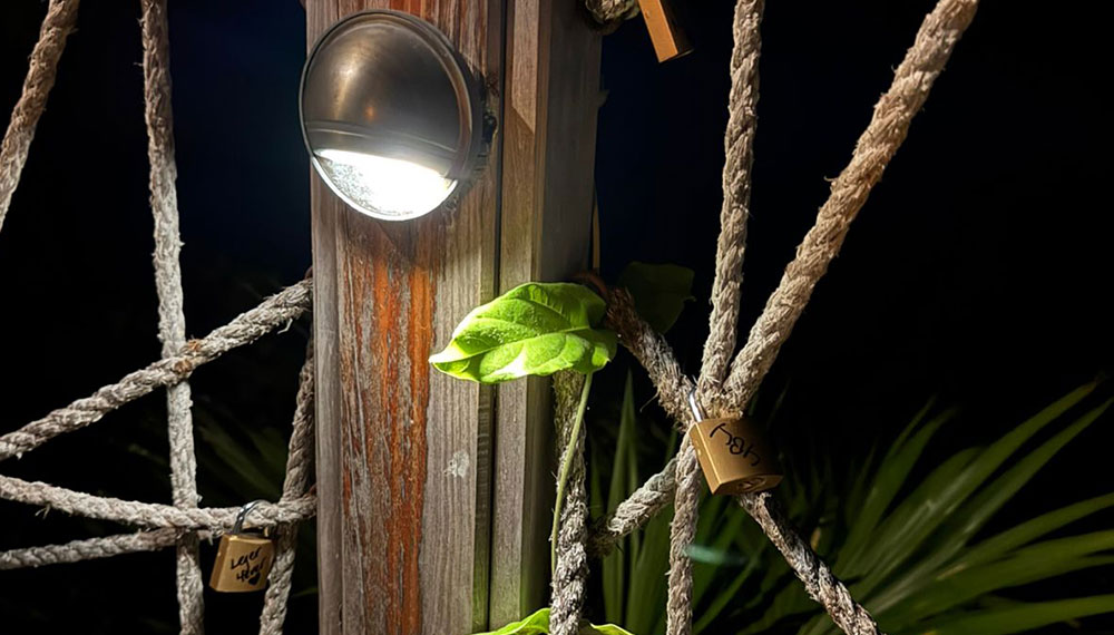 Personalized locks on rope rail around the Green Flash Table