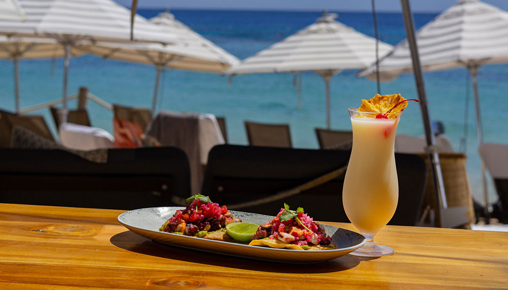 tropical drink + tostada dish at sea cat