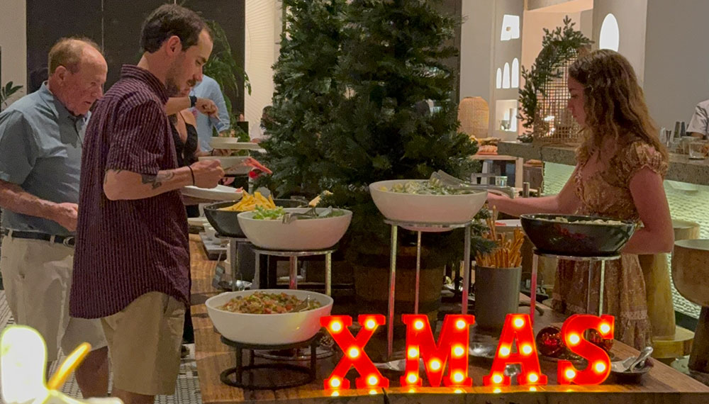 guests enjoying a buffet dinner at Alera on Christmas eve