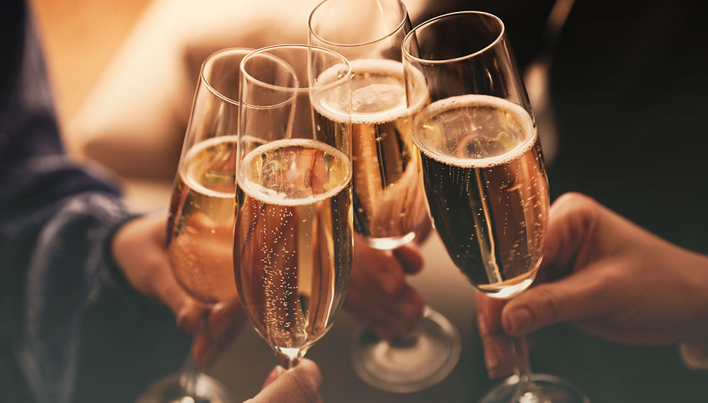 group cheers with sparkling wine