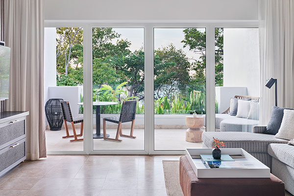 Sitting and balcony area in 1 Bedroom Villa Suite Ocean View at Kimpton Grand Roatan Resort