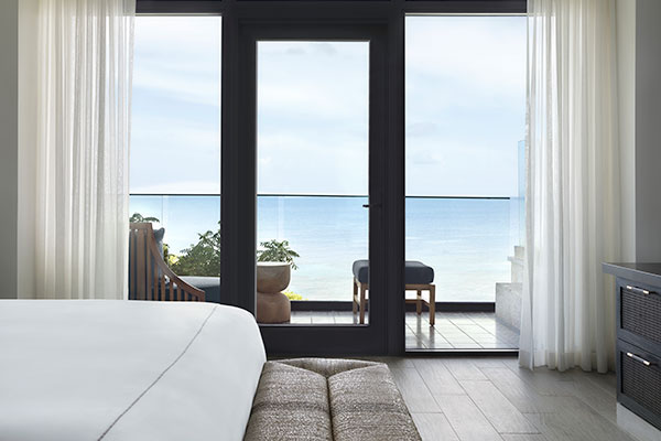 Oceanfront view out of the window of the Roatan Suite at Kimpton Grand Roatan Resort