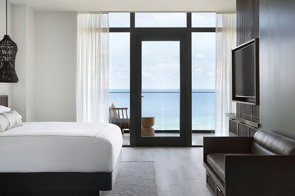 Sleeping area of Roatan Suite with private plunge pool at Kimpton Grand Roatan Resort