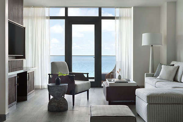 Living area in Roatan Suite with Private Plunge Pool at Kimpton Grand Roatan Resort