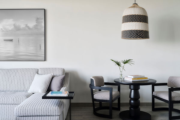 Living and dining area in Roatan Suite with Private Plunge Pool at Kimpton Grand Roatan Resort