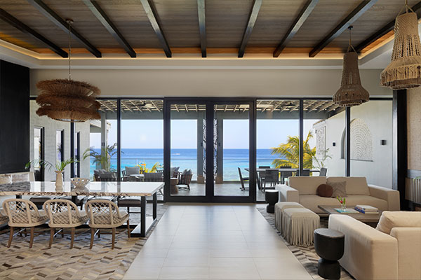 Grand Roatan Two Bedroom Beachfront Penthouse Living Room with Balcony View