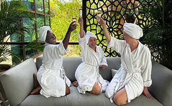 women toasting while in robes at kao kamasa spa