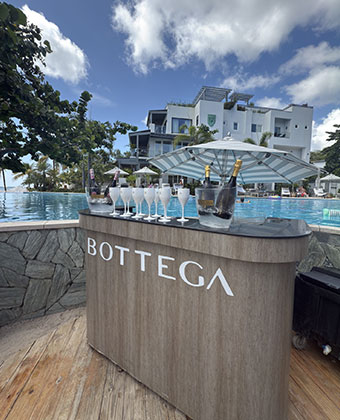 Bottega bubbles table set up by the pool at Kimpton grand roatan