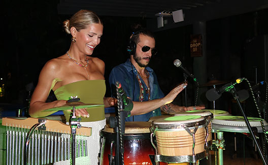 man and woman play drums at Kimpton grand roatan resort